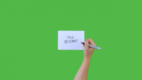 Woman-Writing-Tax-Returns-on-Paper-with-Green-Screen-01